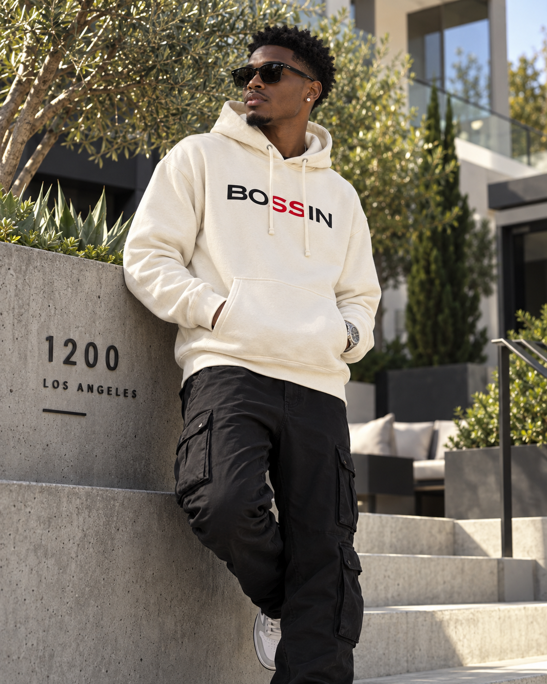 
                  
                    BOSSIN cream OG hoodie lifestyle photo
                  
                